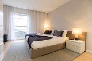 Кровать или кровати в номере Ninon- Premium Trindade by Porto City Hosts