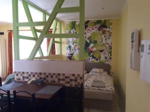 A bed or beds in a room at Rozmaring Apartmanok