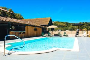 The swimming pool at or close to La Maison du Saula