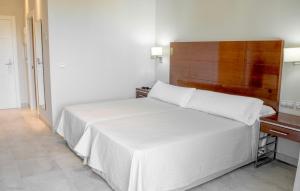 Postel nebo postele na pokoji v ubytování Hotel Atlántico