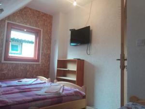 Postel nebo postele na pokoji v ubytování Guest House Vukicevic