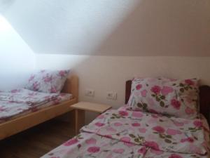 Postel nebo postele na pokoji v ubytování Guest House Vukicevic