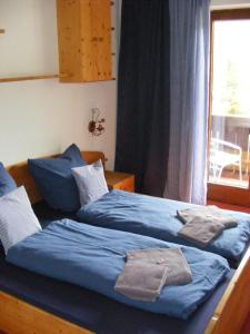 Postel nebo postele na pokoji v ubytování Pension Praxmarer