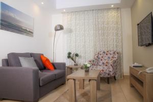 אזור ישיבה ב-Almond Hotel Apartments