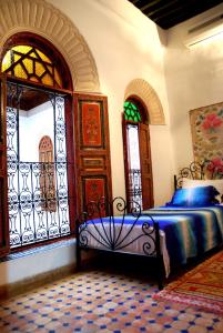 A bed or beds in a room at Dar Hafsa