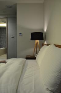 Postel nebo postele na pokoji v ubytování Sun Sweet Hotel