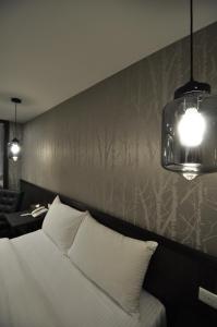Postel nebo postele na pokoji v ubytování Sun Sweet Hotel