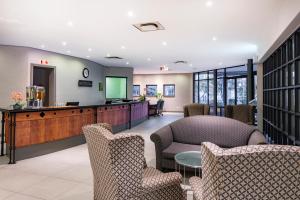 a waiting room with chairs and a table at aha Kopanong Hotel & Conference Centre in Bredell