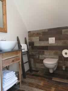 a bathroom with a toilet and a sink at studio B&B Zeeuws licht in Westkapelle
