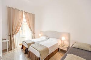 Voodi või voodid majutusasutuse Biancorèroma B&B toas