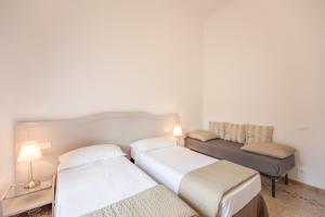 Voodi või voodid majutusasutuse Biancorèroma B&B toas