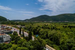 an aerial view of a city with mountains in the background at Hotel Odissey Jaz in Budva