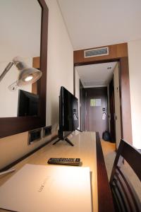 TV a/nebo společenská místnost v ubytování Hotel Lux Fatima
