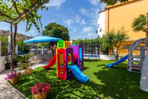 a garden with a playground with a slide at Villa Jadranka Sutomore in Sutomore