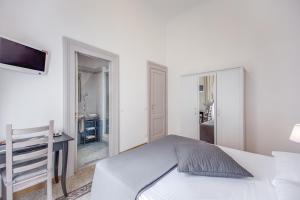 Voodi või voodid majutusasutuse Biancorèroma B&B toas