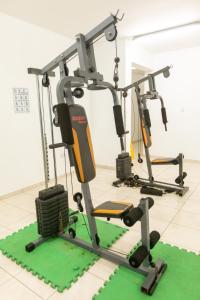 a gym with three exercise bikes in a room at Oceania Bay Village in Pyla