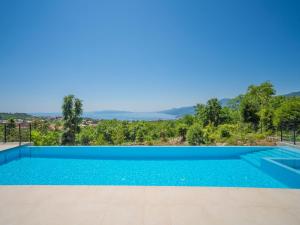 a swimming pool in a villa with a view at Villa Minimal by Interhome in Kastav
