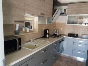 Kuchyň nebo kuchyňský kout v ubytování Mislav Apartment