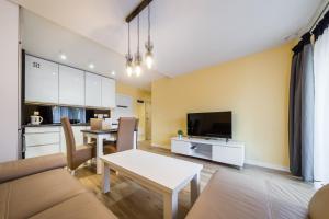 Kuchyňa alebo kuchynka v ubytovaní Apartament Rakowicka 14 Deluxe Old Town WAWELOFTS