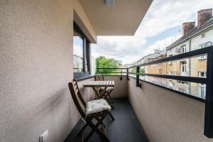 Balkón alebo terasa v ubytovaní Apartament Rakowicka 14 Deluxe Old Town WAWELOFTS