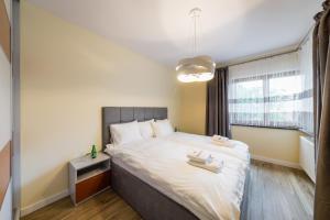 Posteľ alebo postele v izbe v ubytovaní Apartament Rakowicka 14 Deluxe Old Town WAWELOFTS