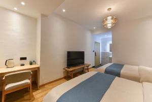 TV a/nebo společenská místnost v ubytování Yifangyan - Tingyuan Qingshe Hostel