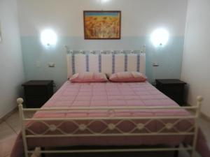 A bed or beds in a room at B&B Is Janas E5391