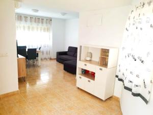 a living room with a couch and a table at RUZAFA 17, OLD TOWN in Benidorm