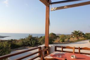 a room with a table and a view of the ocean at Galini in Agia Irini Milos