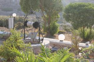 a water fountain with a camera on top of it at Galini in Agia Irini Milos