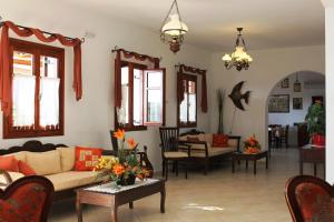 a living room with a couch and chairs at Galini in Agia Irini Milos