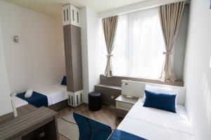 Postel nebo postele na pokoji v ubytování Omia + 37 fotografií