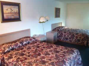 Postel nebo postele na pokoji v ubytování Crown Inn