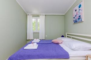 Ліжко або ліжка в номері Apartment Three Olives