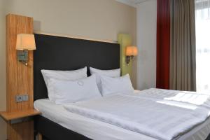 Postel nebo postele na pokoji v ubytování Landhotel Schnuck