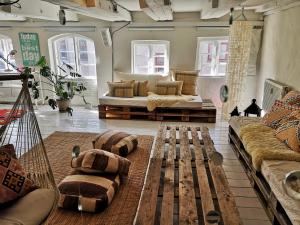 a living room filled with furniture and a couch at A Charming and Beautiful Oasis in the Heart of Copenhagen in Copenhagen