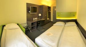 Voodi või voodid majutusasutuse Behringers City Hotel Nürnberg toas