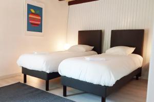 מיטה או מיטות בחדר ב-GITE LE PETIT VAUCHEL A 3,5 KM D'ETRETAT
