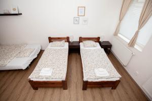 Posteľ alebo postele v izbe v ubytovaní Žižkov Cosy Studio Apartments