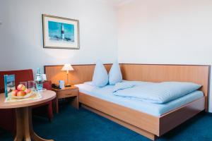 Postel nebo postele na pokoji v ubytování Aparthotel Kachelot