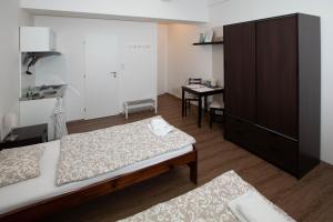 Posteľ alebo postele v izbe v ubytovaní Žižkov Cosy Studio Apartments