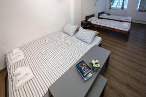 Posteľ alebo postele v izbe v ubytovaní Žižkov Cosy Studio Apartments