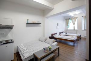 Posteľ alebo postele v izbe v ubytovaní Žižkov Cosy Studio Apartments