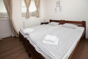 Posteľ alebo postele v izbe v ubytovaní Žižkov Cosy Studio Apartments