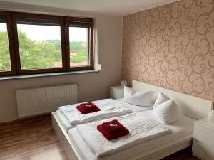 Postel nebo postele na pokoji v ubytování Hotel Am Rittergut