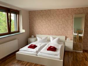 Postel nebo postele na pokoji v ubytování Hotel Am Rittergut