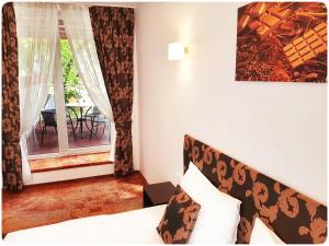 Vivulskis Apart-Hotel tesisinde bir odada yatak veya yataklar