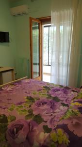 Postel nebo postele na pokoji v ubytování Villa Erry