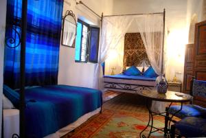 A bed or beds in a room at Dar Hafsa