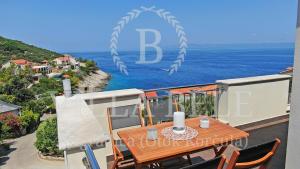 a view of the ocean from the balcony of a house at VILLA BELE - Piece of Peace on the sea in Prigradica